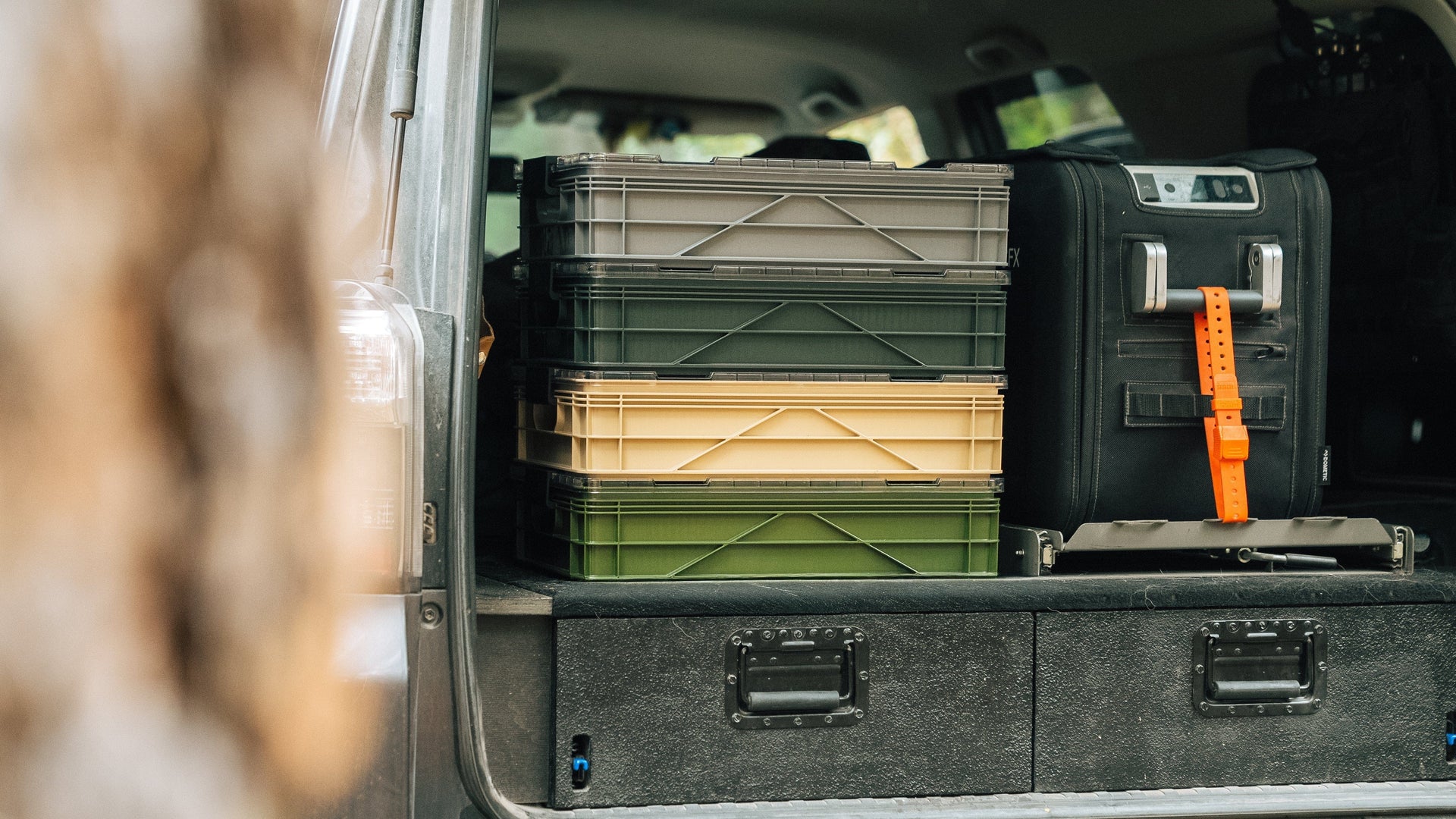 Trunk of a vehicle with storage boxes and equipment